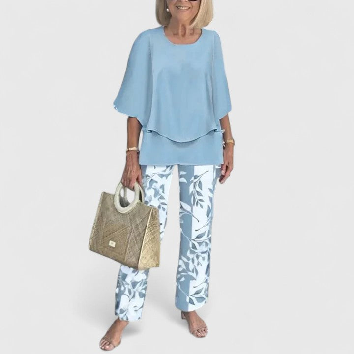 Women’s elegant set in light blue: layered short-sleeve top and blue leaf-print pants