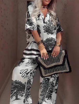 Black and white printed V-neck top with short sleeves and long wide-leg pants, striped accents