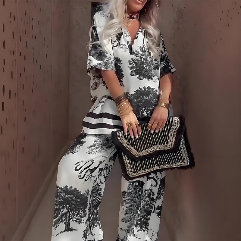 Black and white printed V-neck top with short sleeves and long wide-leg pants, striped accents