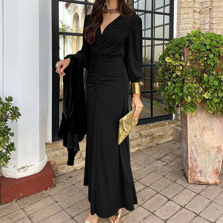 Black V-neck ruched dress with long sleeves and gathered front, midi hem