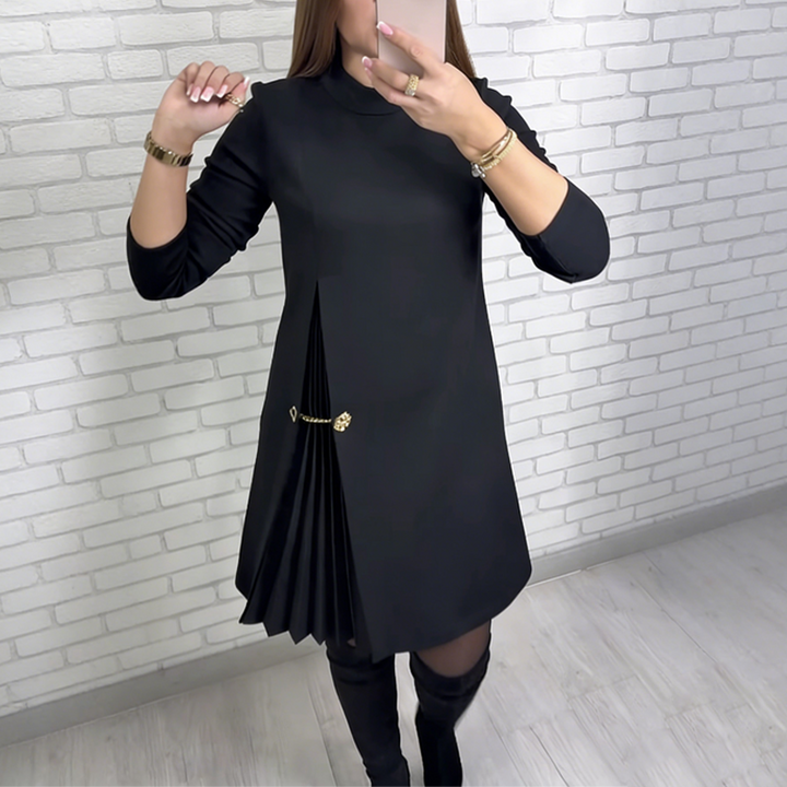 Black turtleneck pleated shift dress with long sleeves and gold button-trim detail