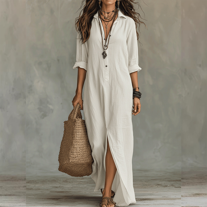 White relaxed midi shirt dress with button front, 3/4 sleeves, and front slit