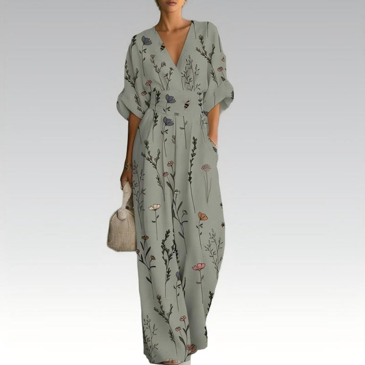 Sage green floral jumpsuit with V-neck, cinched waist, and wide-leg wide cuffs