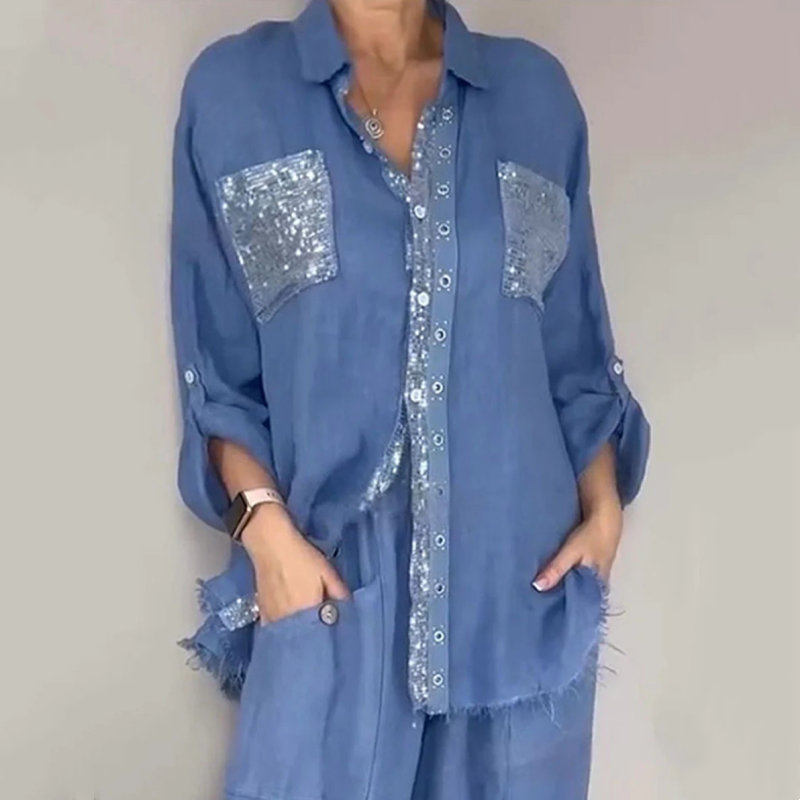 Blue button-up shirt set with silver sequin chest pockets and matching blue pants