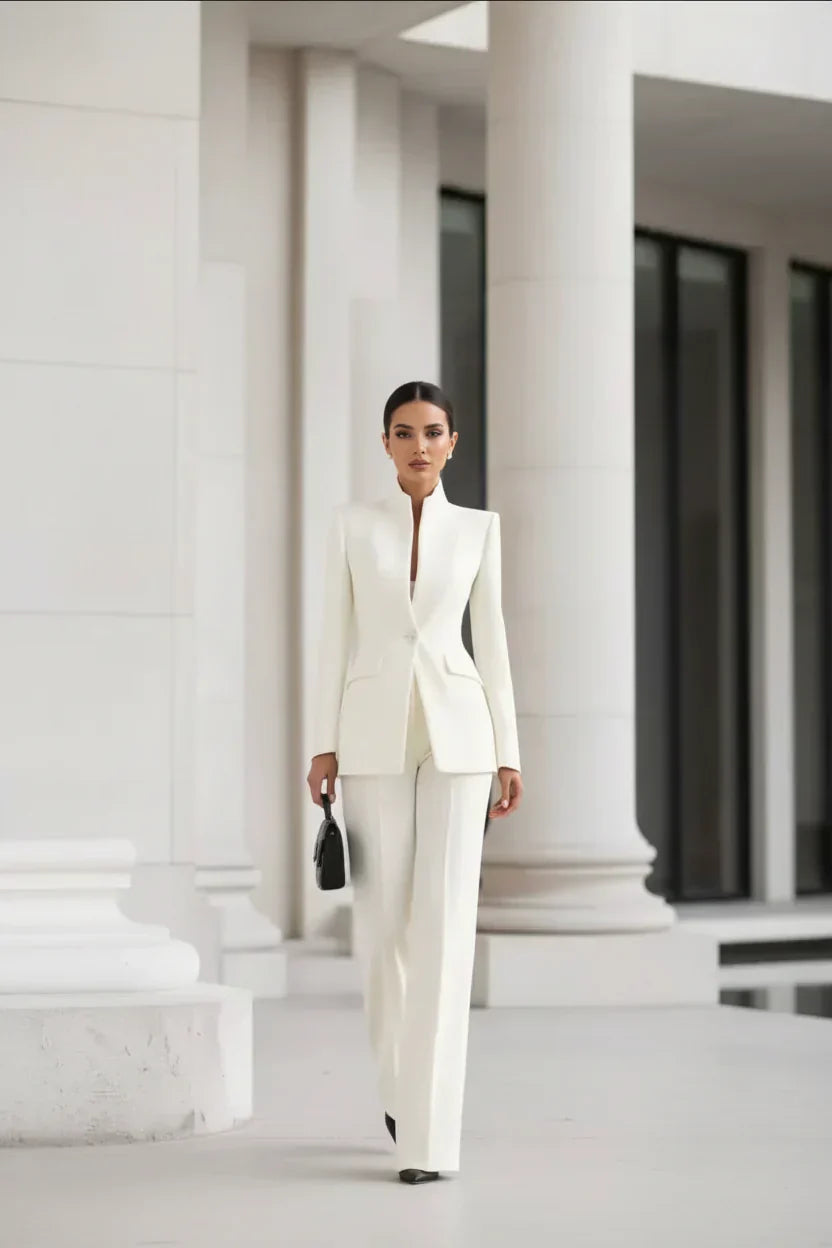 White blazer and wide-leg palazzo pants set, fitted jacket with long sleeves.