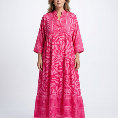 Pink button-front midi dress with V-neck and three-quarter sleeves, patterned print.
