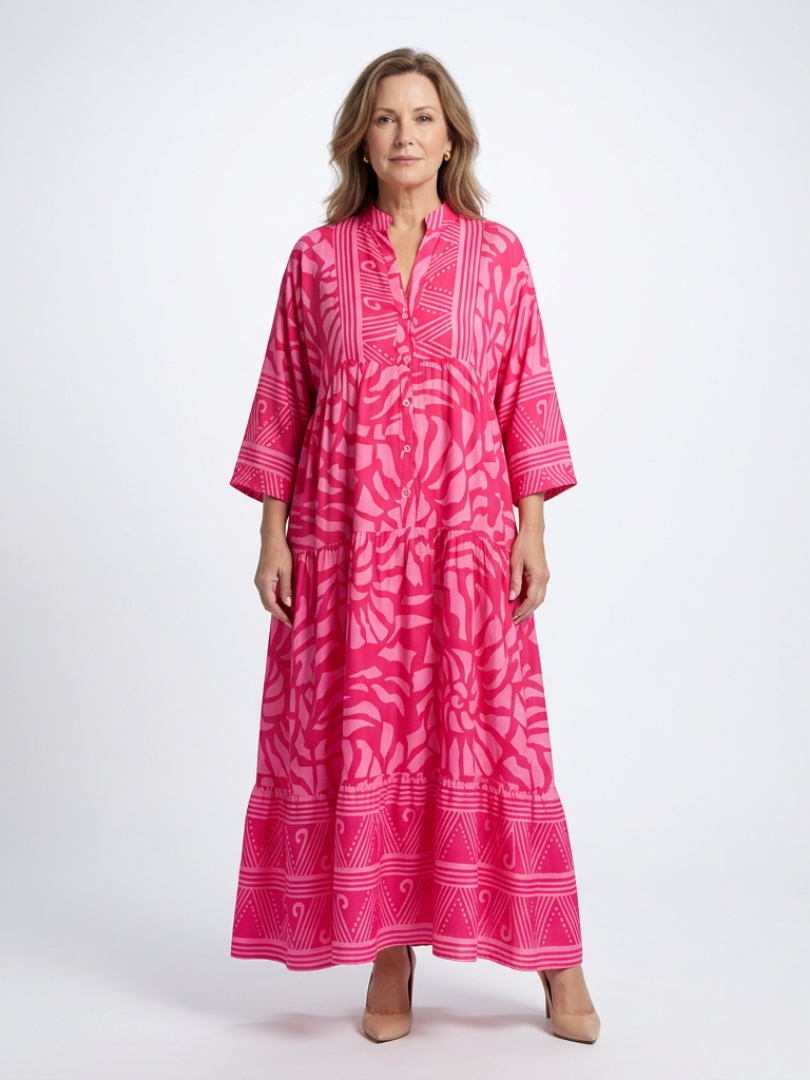 Pink button-front midi dress with V-neck and three-quarter sleeves, patterned print.