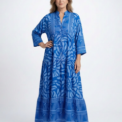 Blue button-front midi dress with V-neck and three-quarter sleeves, patterned print.