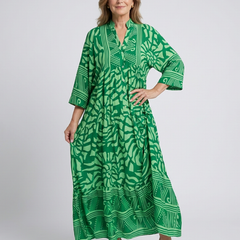 Green button-front midi dress with V-neck and three-quarter sleeves, patterned print.