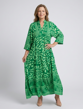 Green button-front midi dress with V-neck and three-quarter sleeves, patterned print.