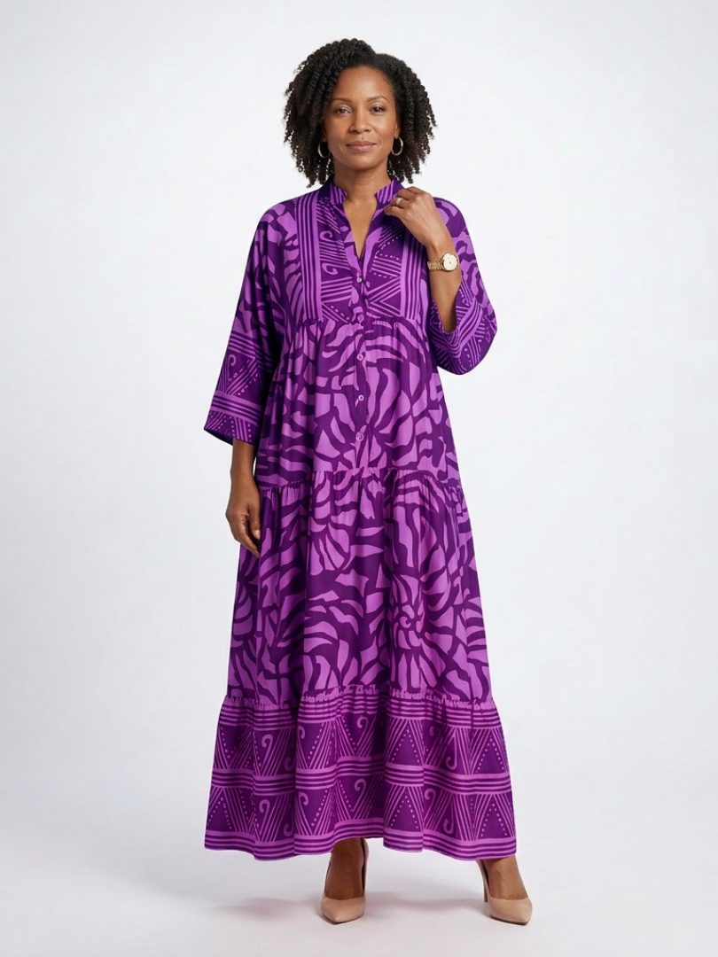 Purple button-front midi dress with V-neck and three-quarter sleeves, bold patterned print.