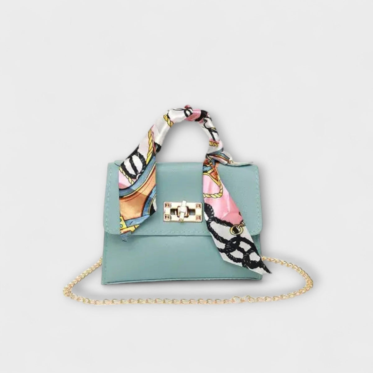 Light blue handbag with gold clasp, chain strap, and multicolor patterned scarf