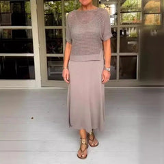Light gray two-piece set with a mesh knit short-sleeve top and flowing midi skirt