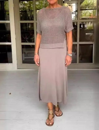 Light gray two-piece set with a mesh knit short-sleeve top and flowing midi skirt