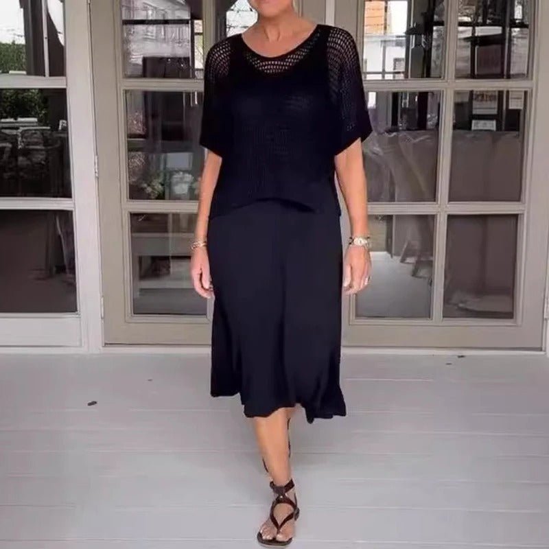 Black two-piece knit top and midi skirt set with short sleeves and a round neckline