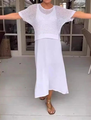 White two-piece knit top and white midi skirt set with short sleeves and a round neck