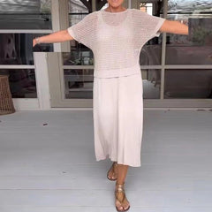 Cream knit two-piece set with a short-sleeve top and white midi skirt