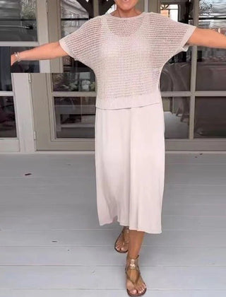 Cream knit two-piece set with a short-sleeve top and white midi skirt