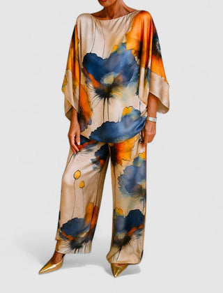Two-piece set with drape-sleeve blouse and wide-leg pants, blue and orange floral print