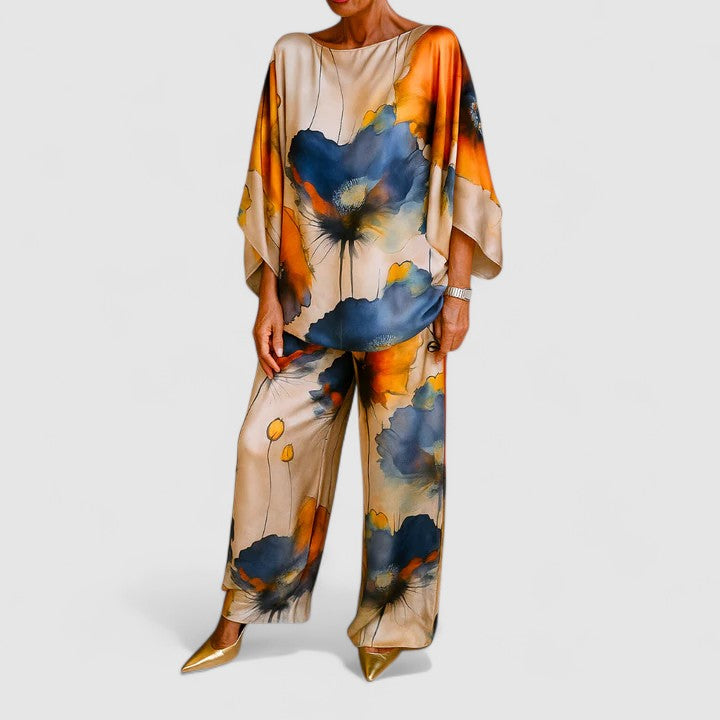 Two-piece set with drape-sleeve blouse and wide-leg pants, blue and orange floral print