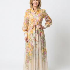 Floral sheer long-sleeve maxi dress with yellow base and pink blossoms, tie waist