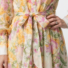 Floral sheer maxi dress close-up, tie waist bow and button placket detail
