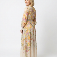 Floral sheer long-sleeve maxi dress in yellow floral print, button front, side view