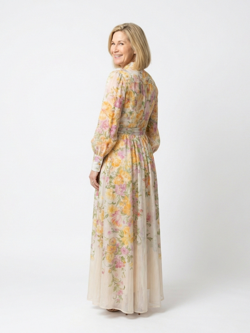 Floral sheer long-sleeve maxi dress in yellow floral print, button front, side view