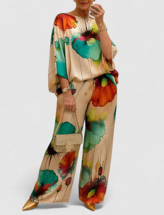 Two-piece set with loose top and wide-leg pants, cream background with green and orange florals