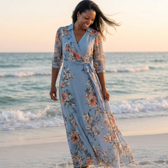 Blue floral wrap V-neck maxi dress with tied waist and flowing skirt