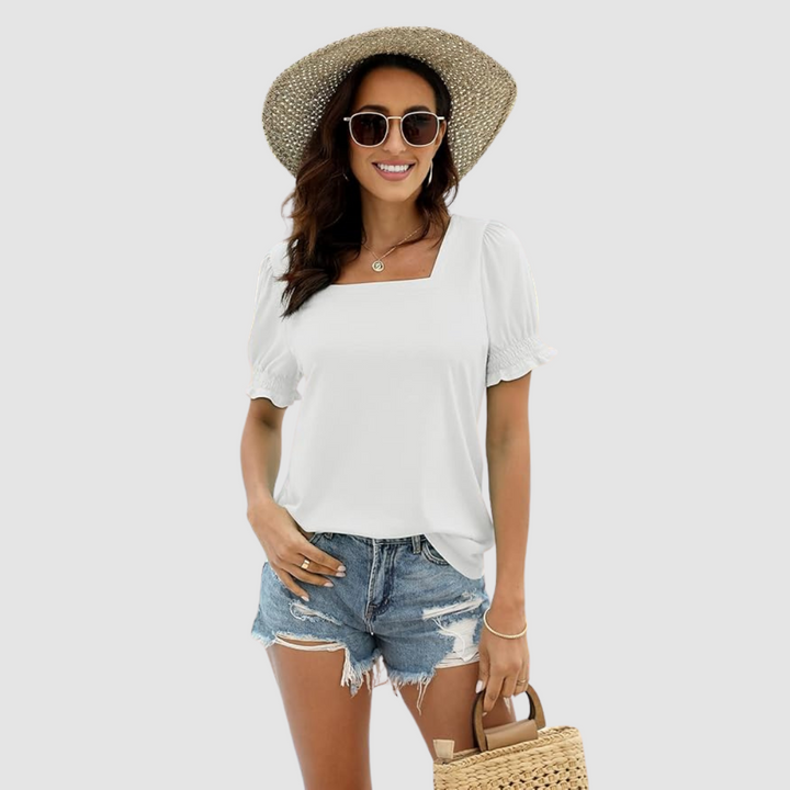 White square-neck blouse with short puff sleeves and gathered cuffs.