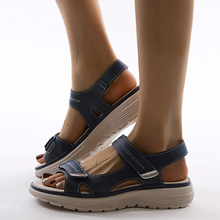 Dark blue supportive sandal with wide straps and thick cushioned platform sole