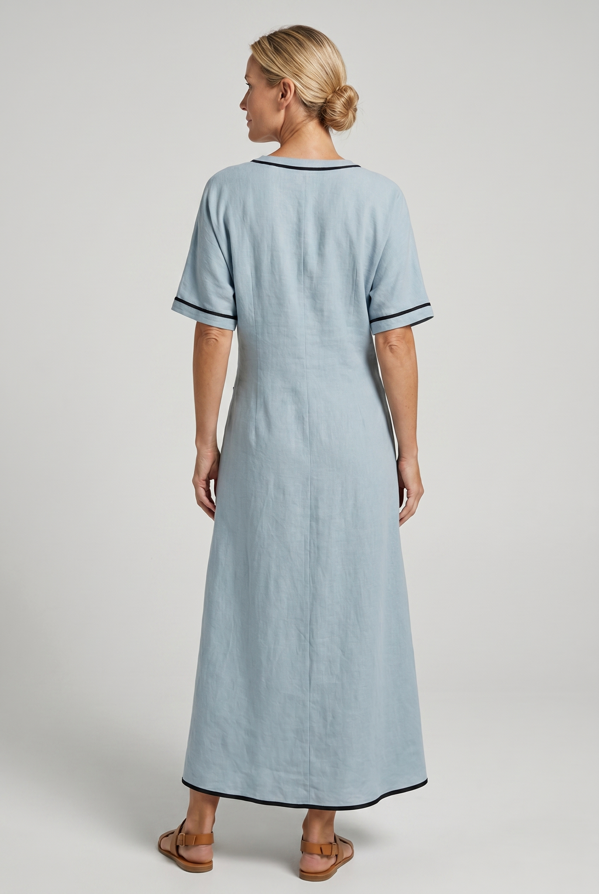 Women's twist-front V-neck maxi dress in blue, back view with short sleeves