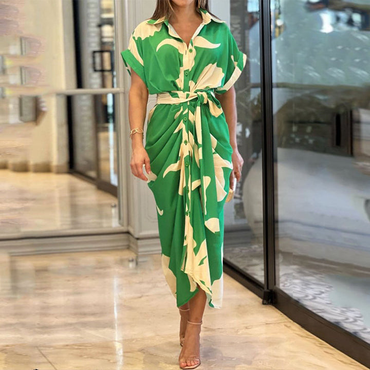 Green wrap maxi dress with cream leaf pattern, short sleeves and tie waist