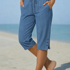 Delphia™ women's calf-length capri pants in blue with drawstring waist and side buttons