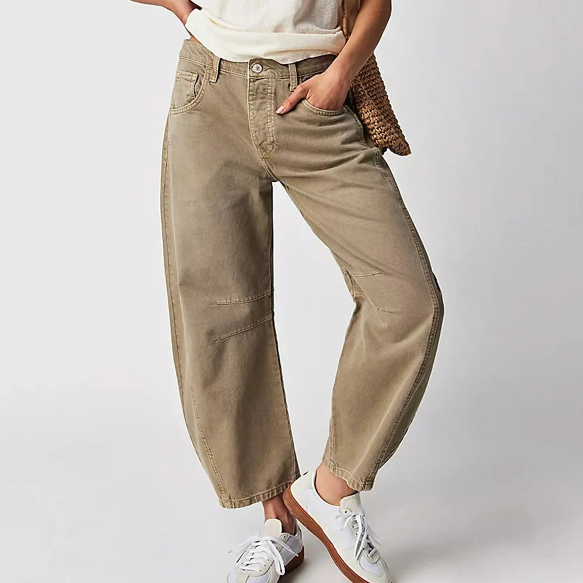 Beige wide-leg jeans with belt loops, button closure, and front patch pockets.